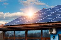 A solar panel installed on the roof of a house.