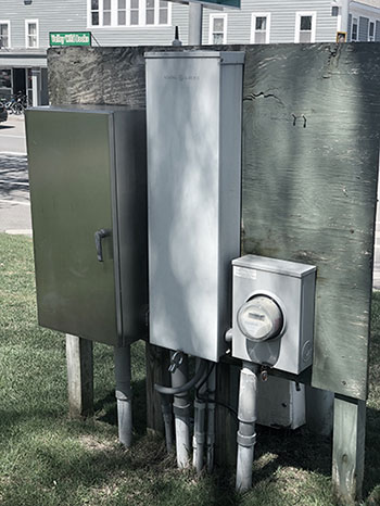 A strut and backboard system in Littleton, Mass. with multiple elements for power distribution mounted on it.