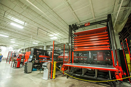 An Amada machine installed at the Kansas City plant helps press metal that makes metering products.