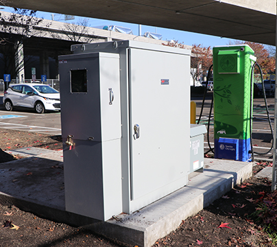 W-size Milbank enclosed control with higher amperage powering EV charging station.