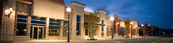 An exterior shot of the front of a strip mall.